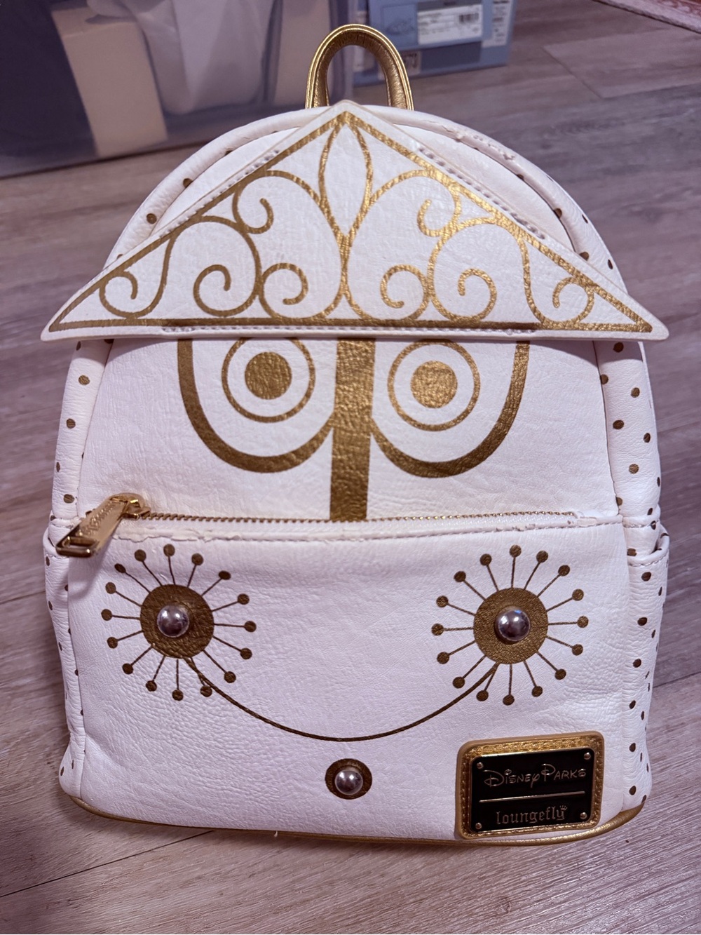 Loungefly It’s A Small World White and Gold Carousel Mini Backpack